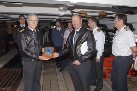 Captain Rocha e Abreu, from Frigate D. Fernando II e Glï¿½ria, (left) receives EMF crest from EUROMARFOR Permanent Cell Director, Captain Santos Madeira (right)